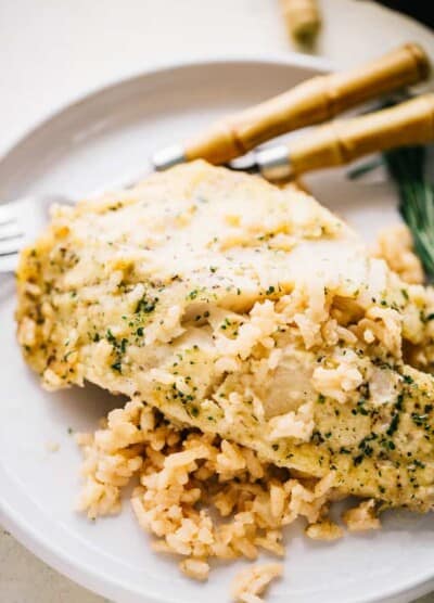 One Pan Risotto with Garlic Herb Tilapia – Delicious, garlicky tilapia set over a flavorful bed of rice, all baked to a creamy perfection!