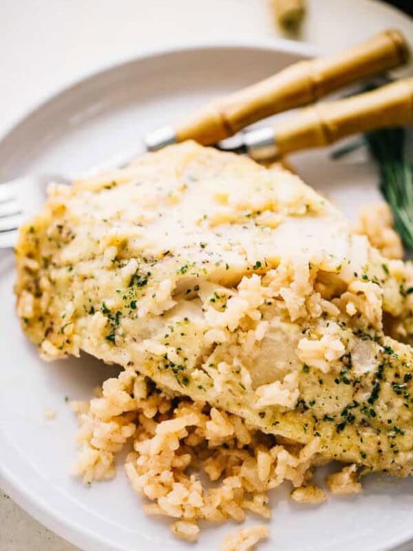 One Pan Risotto with Garlic Herb Tilapia – Delicious, garlicky tilapia set over a flavorful bed of rice, all baked to a creamy perfection!