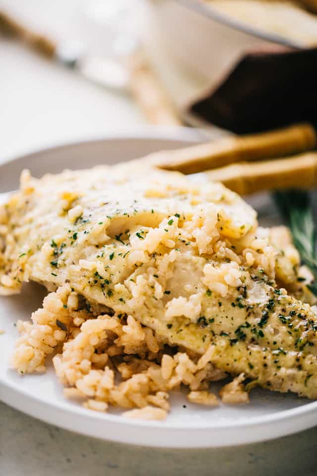 One Pan Risotto with Garlic Herb Tilapia – Delicious, garlicky tilapia set over a flavorful bed of rice, all baked to a creamy perfection!