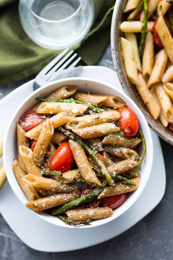 Bowl of penne with asparagus in a balsamic sauce.