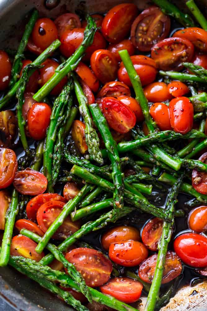 Tomatoes and asparagus mixed together.