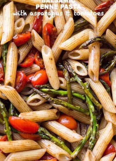 Penne pasta with tomatoes and asparagus and balsamic sauce.