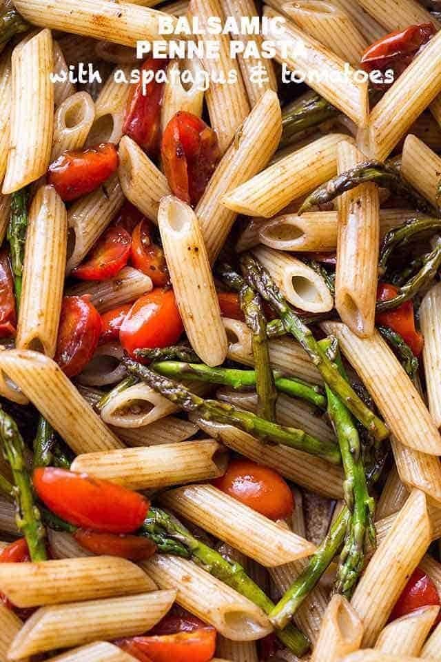 Penne pasta tossed with cooked asparagus and fresh tomatoes.