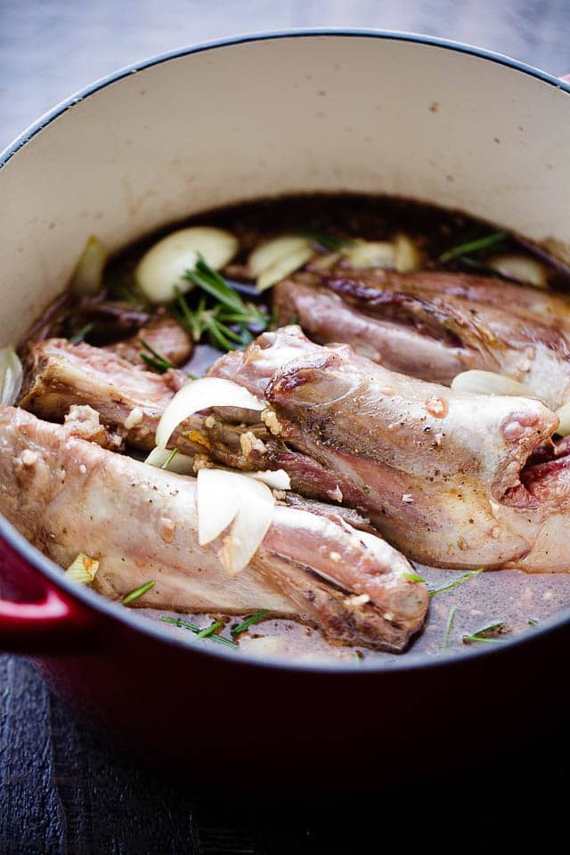 Balsamic Braised Lamb Shanks - A traditional and delicious Easter main dish prepared with lamb shanks slow cooked to a melt in your mouth perfection with balsamic vinegar, wine, garlic and rosemary. 