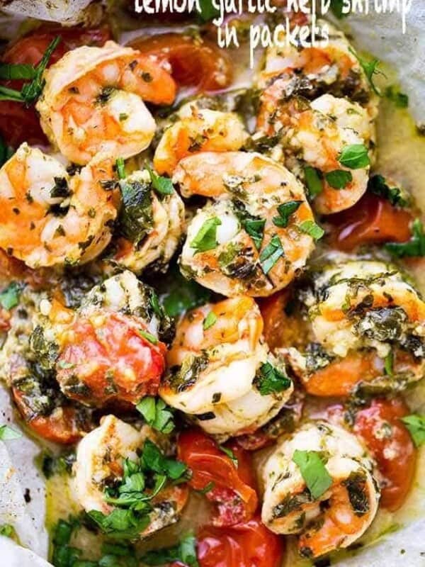 Lemon Garlic Herb Shrimp in Packets - This is the BEST, most delicious baked shrimp recipe made with an amazing lemon garlic herb sauce and cooked inside parchment packets!