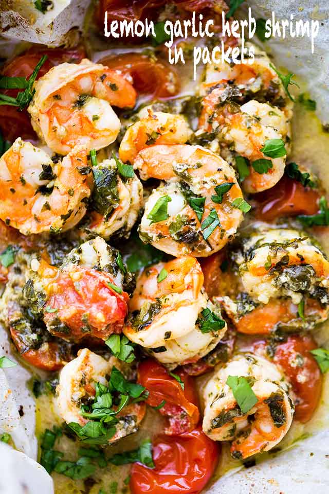 Lemon Garlic Herb Shrimp in Packets - This is the BEST, most delicious baked shrimp recipe made with an amazing lemon garlic herb sauce and cooked inside parchment packets!