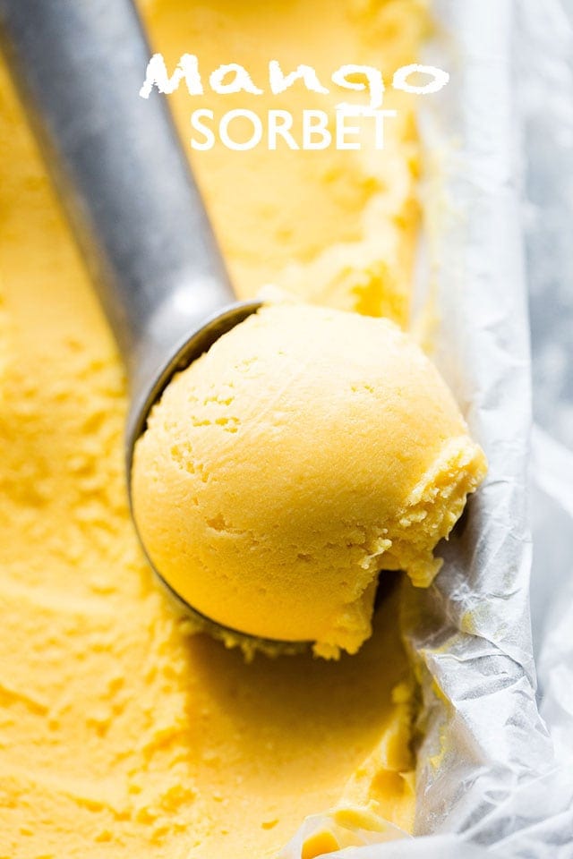 Ice cream scoop scooping out Mango Sorbet.