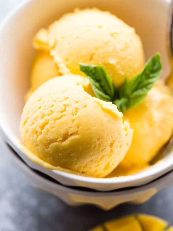 Mango Sorbet Recipe - Sweet, tart, rich, and SO delicious Mango Sorbet made with just 5 ingredients, and without an ice cream maker!