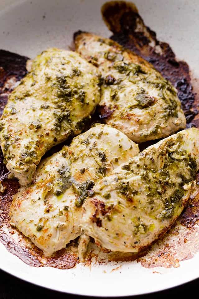 Creamy Pesto Chicken - Create a restaurant-style meal at home with this flavor-packed, creamless Creamy Pesto Chicken dinner that comes together in just 30 minutes!