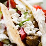 Turkey Meatballs Pita Pockets with Cucumber Yogurt Sauce - Juicy and delicious turkey meatballs served in warm pita pockets filled with a garlicky cucumber sauce and topped with a tomatoes and feta cheese salad.