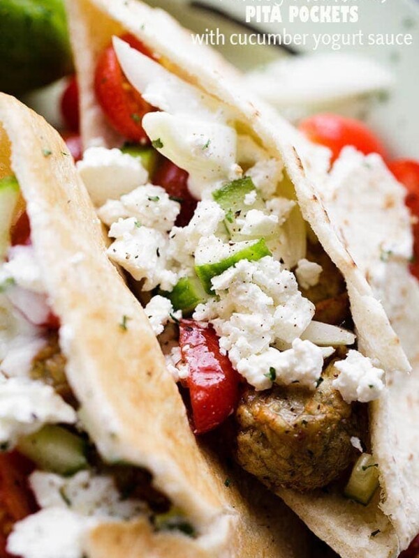 Turkey Meatballs Pita Pockets with Cucumber Yogurt Sauce - Juicy and delicious turkey meatballs served in warm pita pockets filled with a garlicky cucumber sauce and topped with a tomatoes and feta cheese salad.