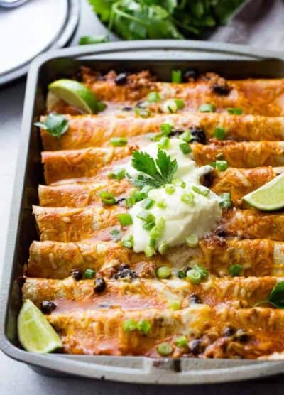 Ground Turkey Black Bean Enchiladas - Loaded with ground turkey and black beans, these saucy, cheesy enchiladas are super easy to make and are always everyone's favorite!
