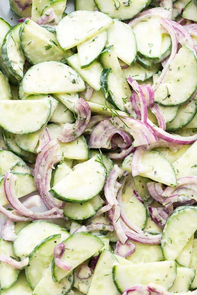 Cucumber slices and sliced onions tossed with creamy dressing and dill