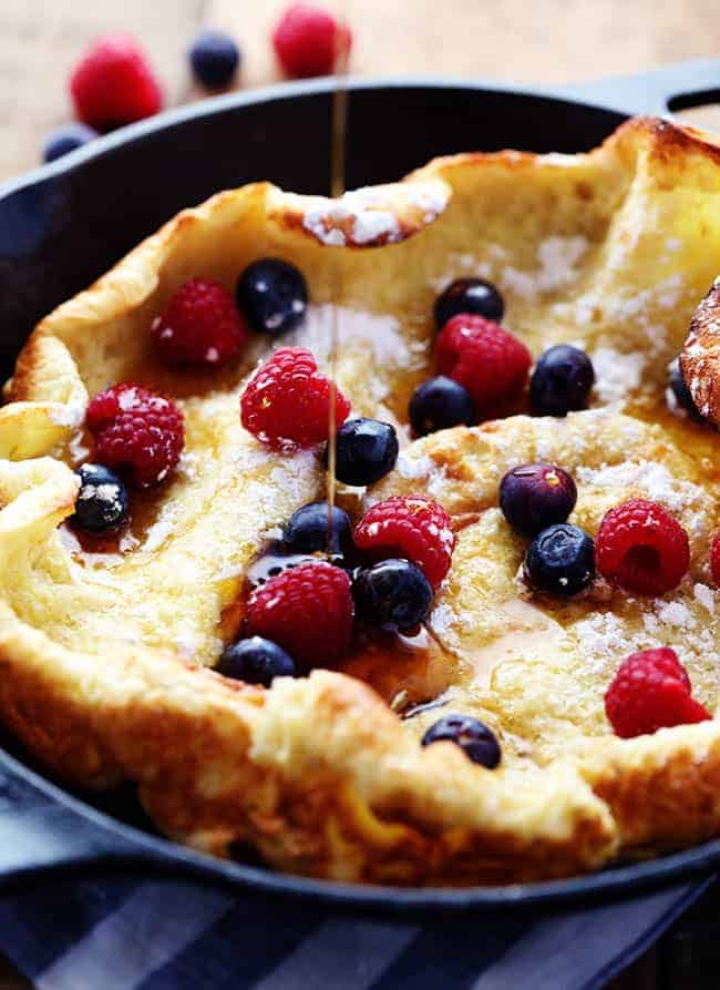 German Oven Pancake topped with fresh berries in a pan