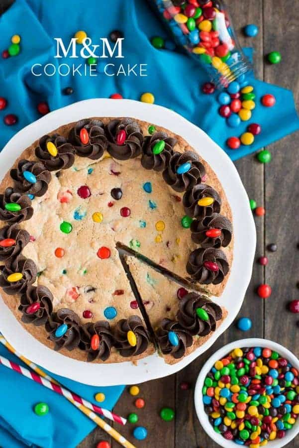 Top view of M&M Cookie Cake with chocolate frosting swirls