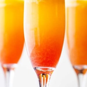Sunrise Mimosa Recipe - A gorgeous and delicious twist to the classic mimosas prepared with mangos, orange juice, prosecco and liqueur.