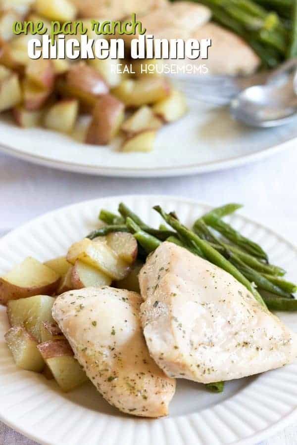 One Pan Ranch Chicken breasts on a plate with roasted potatoes and green beans
