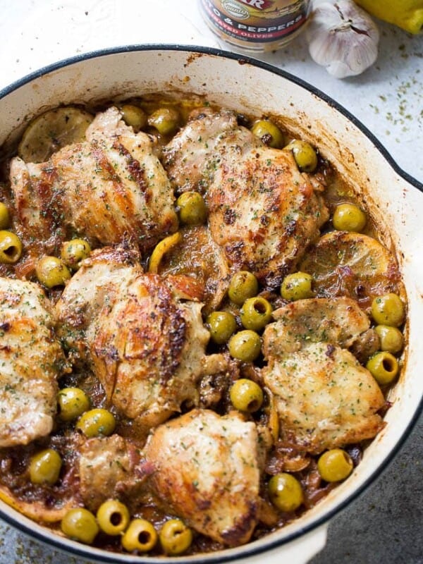 Saucy Skillet Chicken with Lemons and Olives - Delicious pan seared chicken thighs prepared with olives, lemons, and red wine.