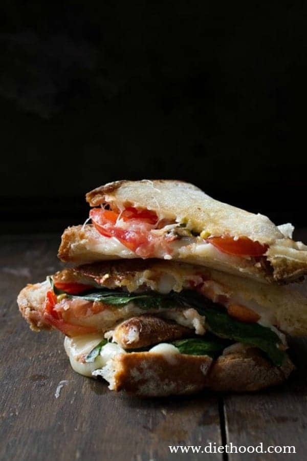 Caprese grilled cheese sandwich halves stacked