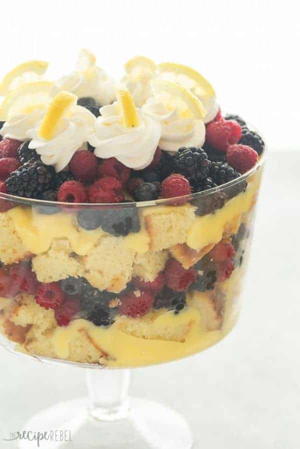 Lemon berry trifle in a trifle bowl with whipped cream swirls on top