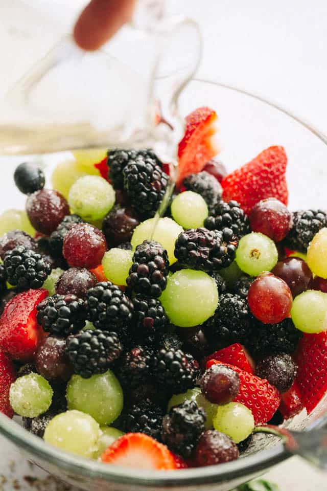 Moscato Fruit Salad - Prepared with colorful grapes and berries, this light, boozy, and delicious fresh fruit salad makes the perfect accompaniment to your summer nights!