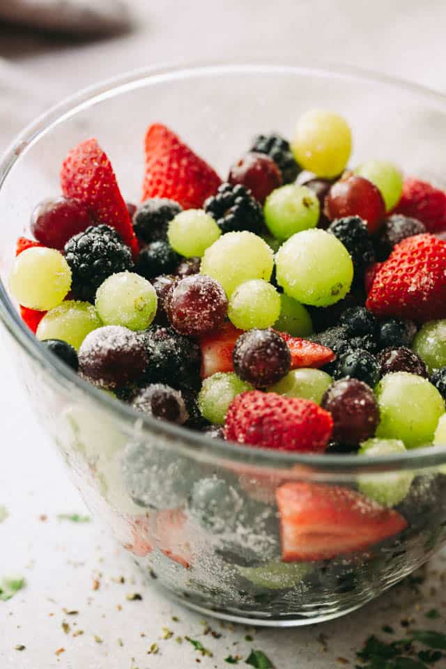 Moscato Fruit Salad - Prepared with colorful grapes and berries, this light, boozy, and delicious fresh fruit salad makes the perfect accompaniment to your summer nights!