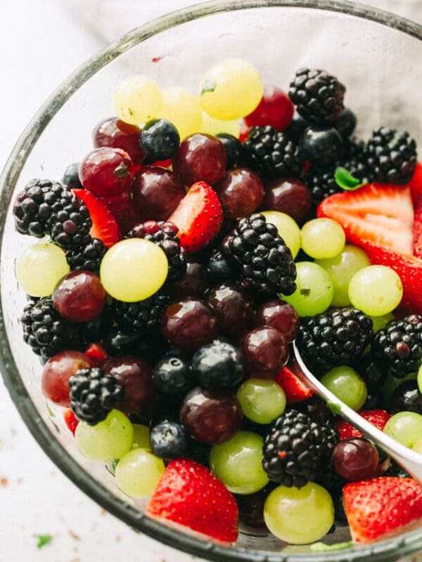 Moscato Fruit Salad - Prepared with colorful grapes and berries, this light, boozy, and delicious fresh fruit salad makes the perfect accompaniment to your summer nights!