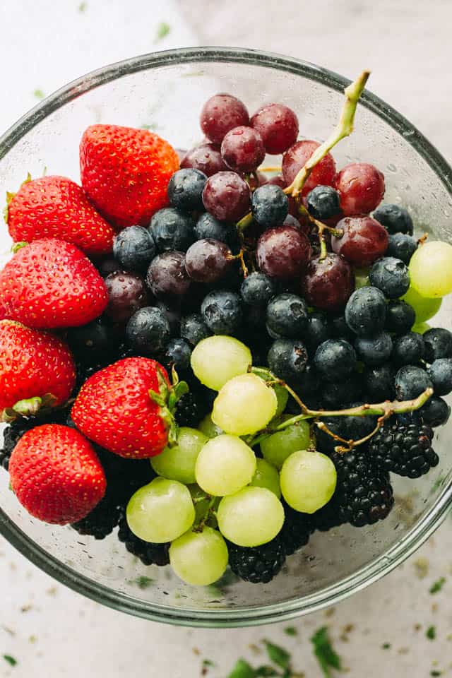 Moscato Fruit Salad - Prepared with colorful grapes and berries, this light, boozy, and delicious fresh fruit salad makes the perfect accompaniment to your summer nights!