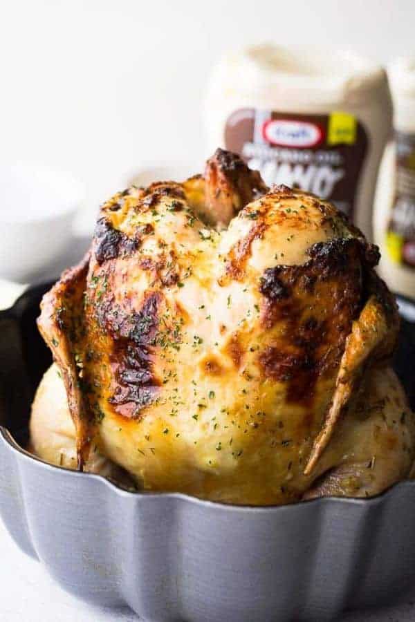 A whole roasted chicken in a bundt pan