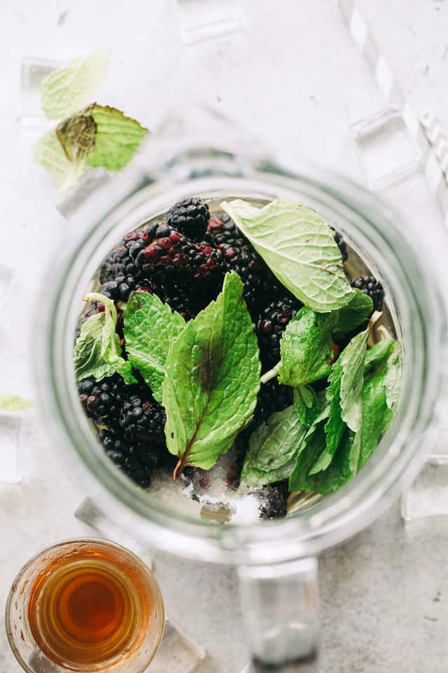 Blackberry Mint Julep - Sweet and fruity summer cocktail prepared with blackberries, mint, and bourbon. 