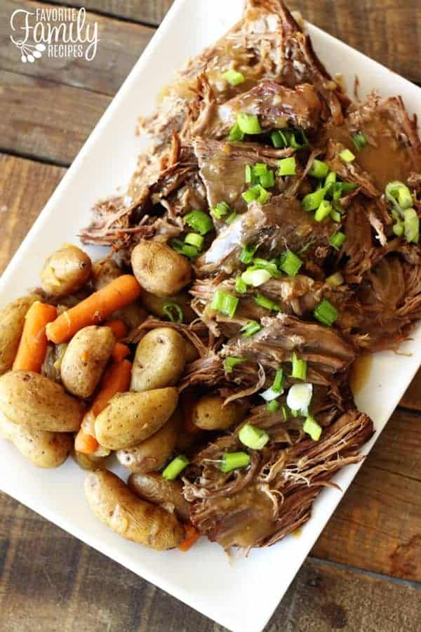 Sunday Pot Roast on a platter with beef, potatoes and baby carrots