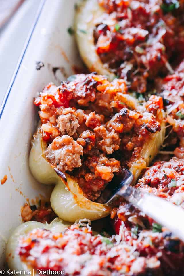 Bolognese Stuffed Peppers - A flavorful bolognese inspired filling prepared with ground meat, bacon, cheese, and seasonings stuffed into bell peppers and roasted to a delicious perfection!