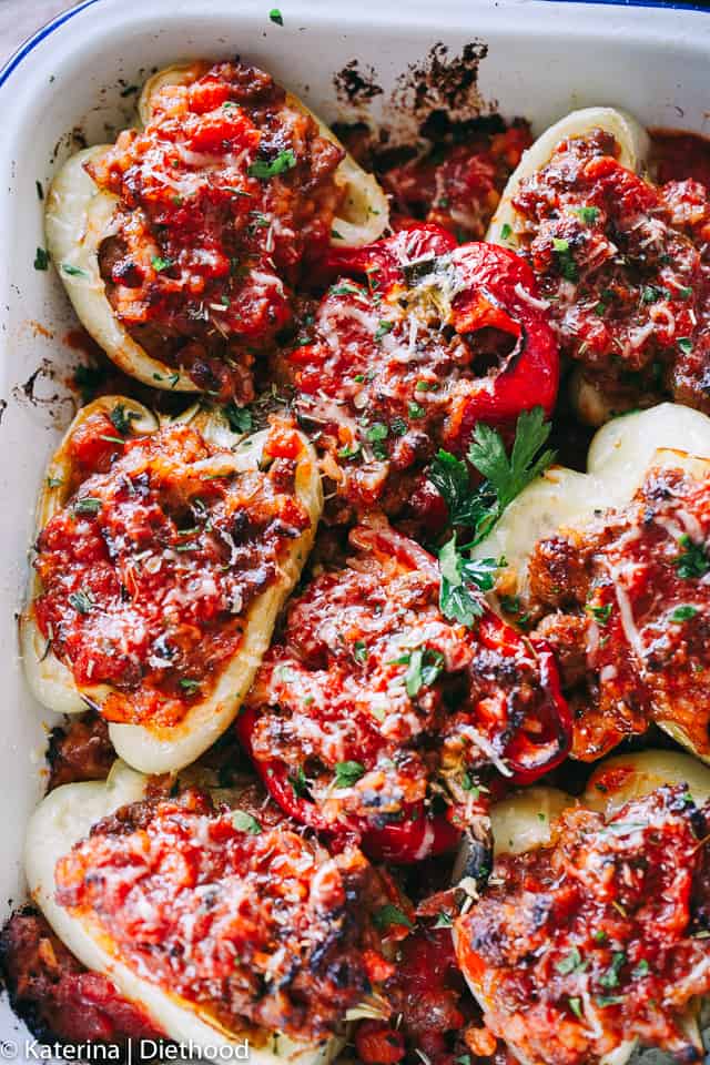 Bolognese Stuffed Peppers - A flavorful bolognese inspired filling prepared with ground meat, bacon, cheese, and seasonings stuffed into bell peppers and roasted to a delicious perfection!