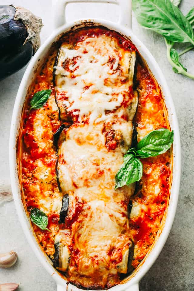 Overhead image of Eggplant Rollatini in an oval baking dish.