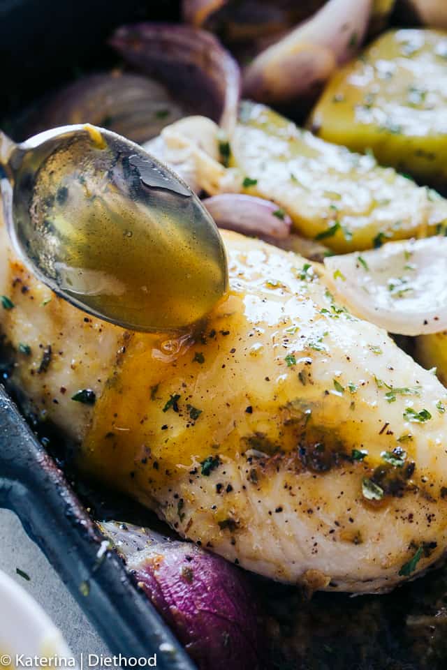 One Pan Roasted Chicken and Potatoes - Quick and easy one pan dinner recipe with chicken coated in a sweet and savory honey mustard sauce and roasted alongside seasoned and incredibly flavorful potatoes and red onions. 