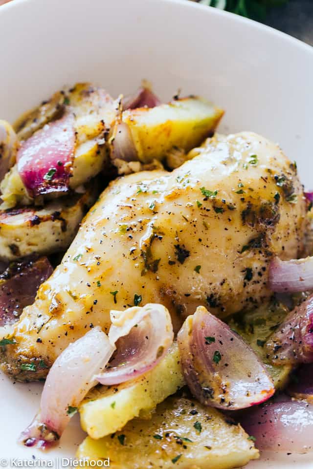 One Pan Roasted Chicken and Potatoes served on a white dinner plate.