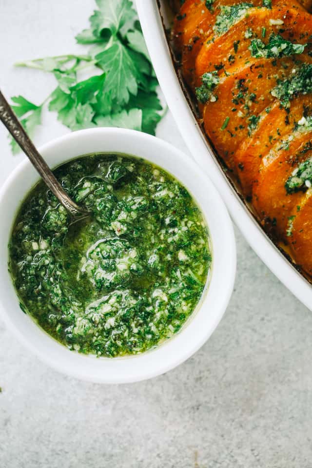 Parsley Pesto Recipe - A delicious twist on pesto prepared with parsley, walnuts, and parmesan cheese. It's great for pizzas, sandwiches, toppings, even pasta!
