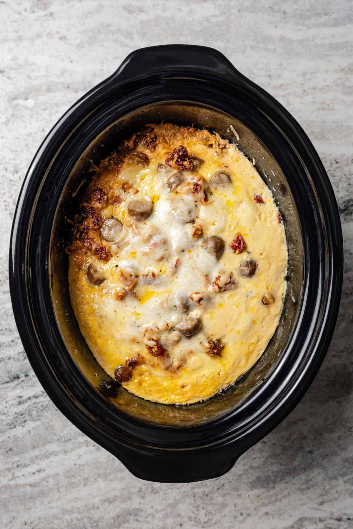 Overhead view of a finished crock pot breakfast casserole inside the slow cooker.