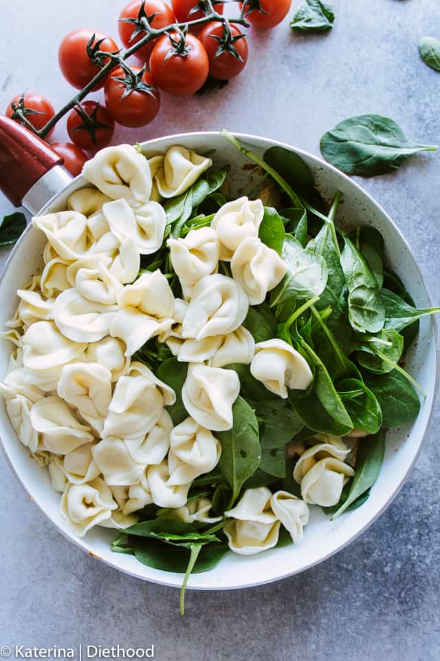 Easy Creamy Chicken Pesto Tortellini - Delicious, super easy dinner with creamy, cheesy tortellini, basil pesto, chicken and spinach.