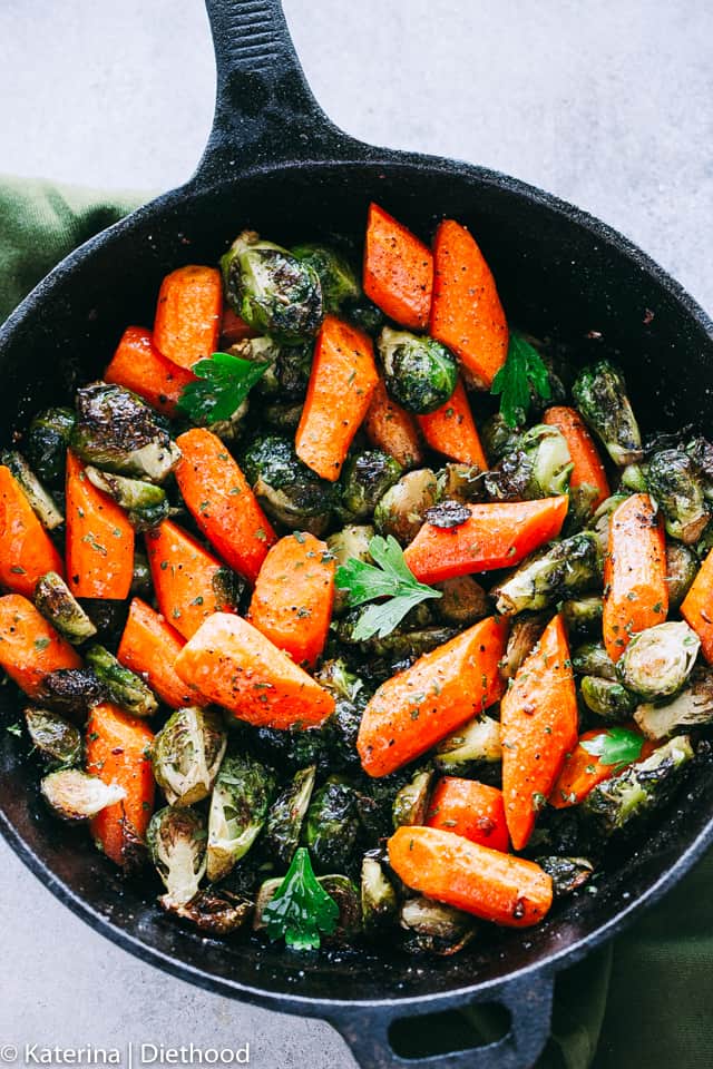 Cooking Brussels Sprouts and Carrots in a skillet.