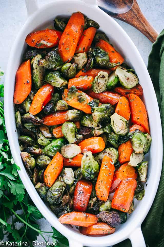 Brussels Sprouts and Carrots in an oval baking dish.