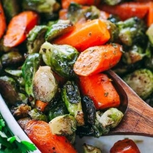Garlic Brown Butter Roasted Brussels Sprouts and Carrots - Incredible Holiday side dish with brussels sprouts and carrots tossed in garlic brown butter and roasted to a delicious perfection!