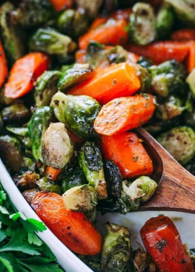 Garlic Brown Butter Roasted Brussels Sprouts and Carrots - Incredible Holiday side dish with brussels sprouts and carrots tossed in garlic brown butter and roasted to a delicious perfection!