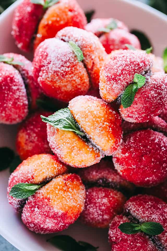 Up close photo of stacked Peach Cookies garnished with mint leaves.