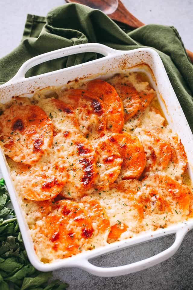 Overhead image of baked Sweet Potato Gratin covered in melty cheese.
