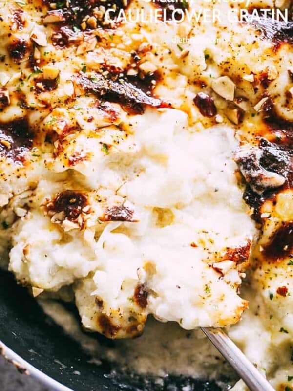 Creamy Cheesy Cauliflower Gratin - Lightened up, no-cream creamy cauliflower gratin that's so easy to prepare and makes for one delicious Holiday side dish recipe! 