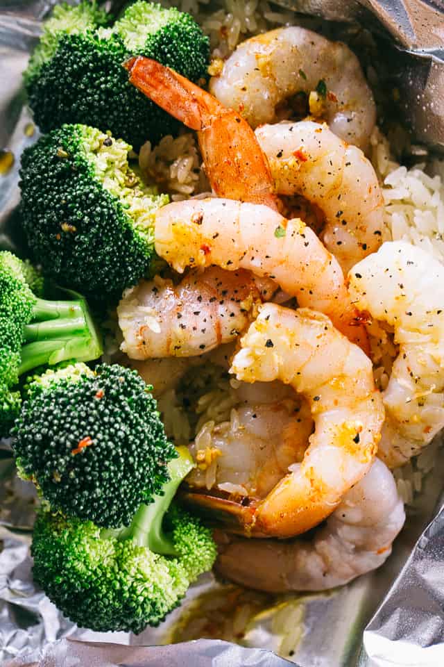 Shrimp Foil Packets with Broccoli and Rice - These foil packets are loaded with shrimp, broccoli and rice tossed in a delicious Asian inspired sauce, and they make for a quick, easy dinner packed with flavor!