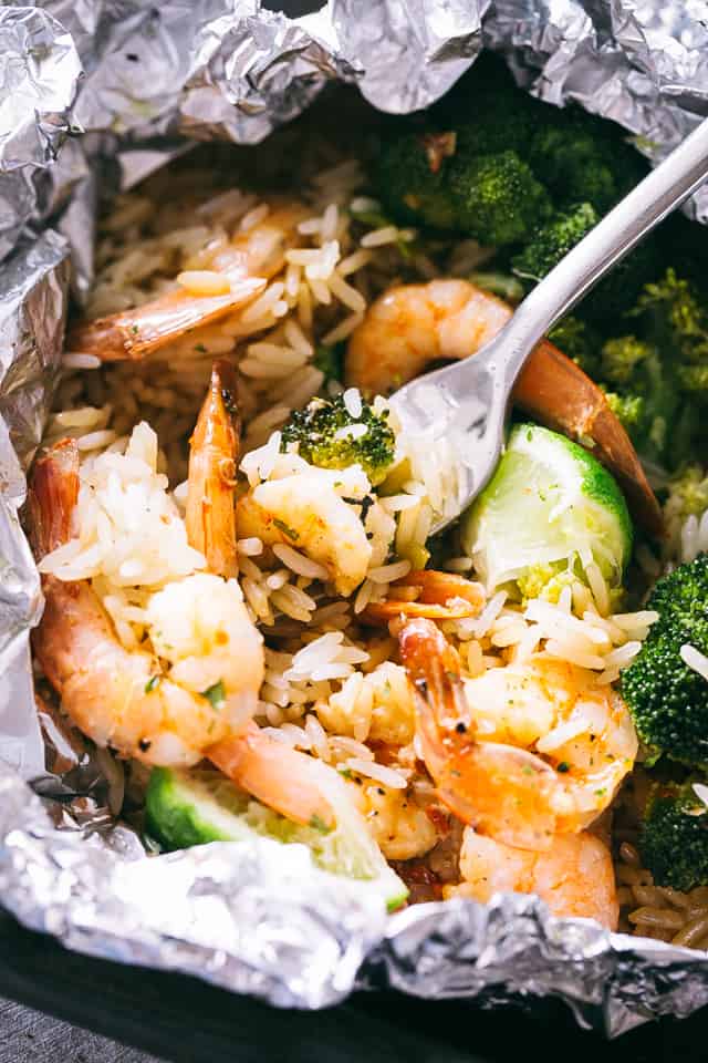 Shrimp Foil Packets with Broccoli and Rice - These foil packets are loaded with shrimp, broccoli and rice tossed in a delicious Asian inspired sauce, and they make for a quick, easy dinner packed with flavor!