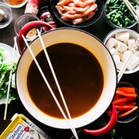 Easy Chinese Hot Pot Recipe - A simple take on the traditional Chinese Hot Pot prepared with a warm and spicy broth chock full of veggies, noodles, and chicken. 