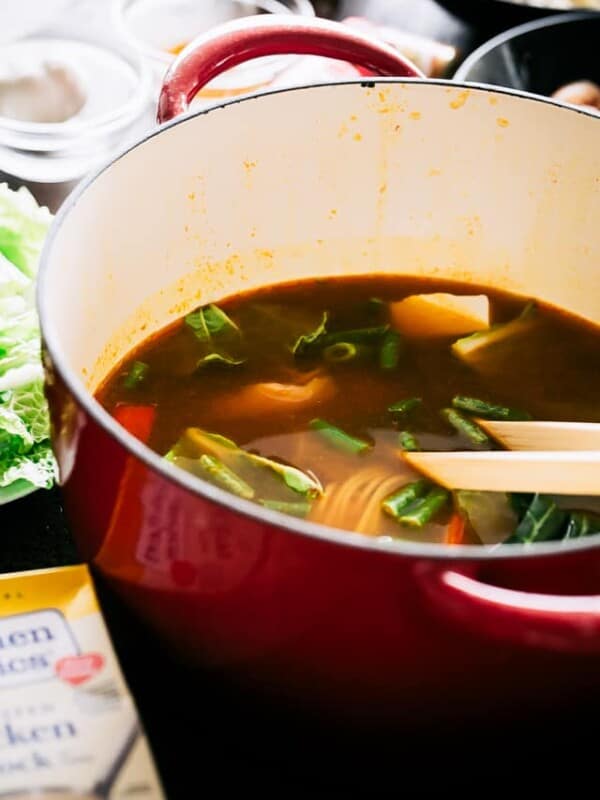 Easy Chinese Hot Pot Recipe - A simple take on the traditional Chinese Hot Pot prepared with a warm and spicy broth chock full of veggies, noodles, and chicken. 